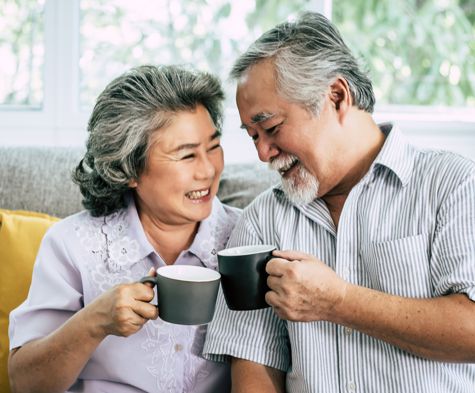 Retired couple enjoying cups of coffee